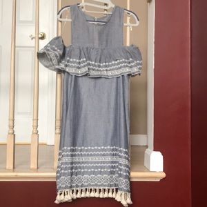 Blue dress with white sequence. Ruffles at bottom